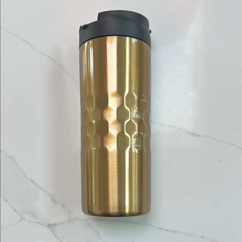 Primula double wall vacuum sealed stainless steel travel mug with flip top lid.